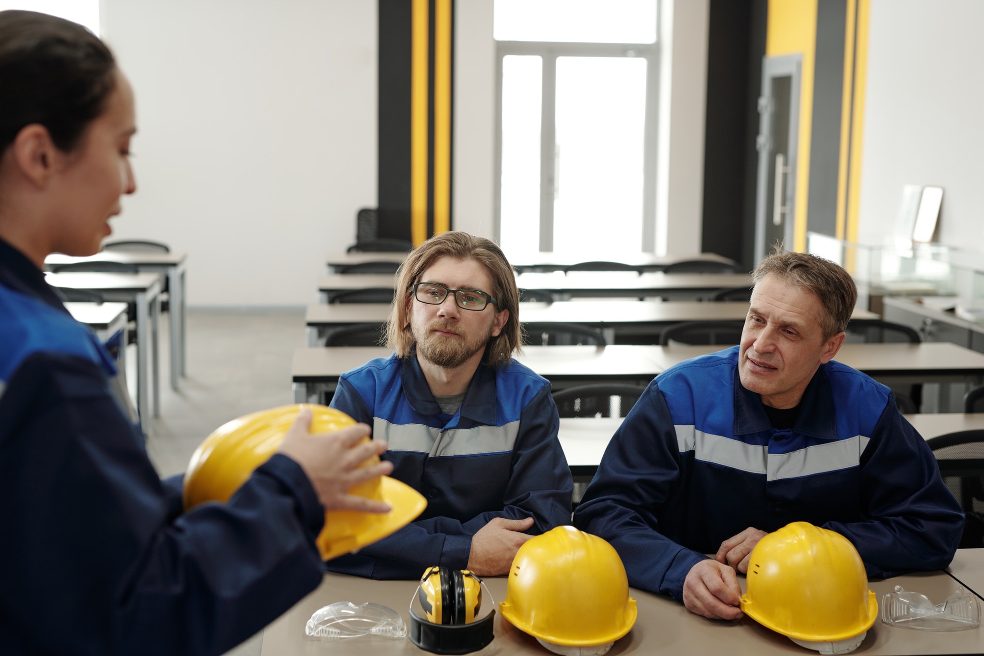 Workers sitting in factory canteen